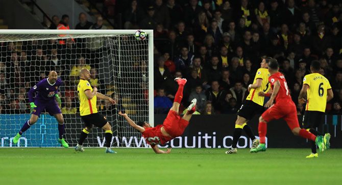Liverpool FC's Amre Can scores through a stunning bicycle kick during their English Premier League match against Watford on Monday