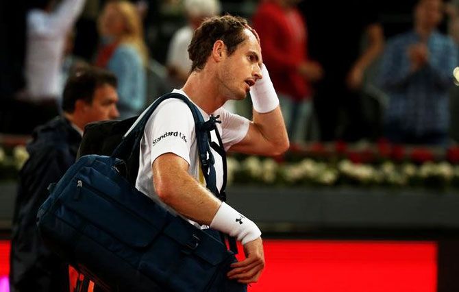Andy Murray walks off the court after his loss against Borna Coric in the third round of the Madrid Open on Thursday