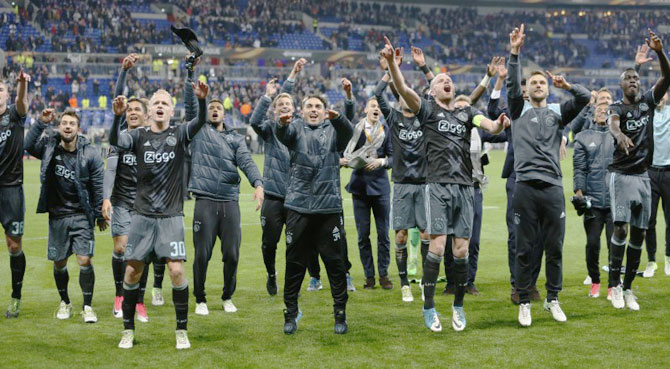 Players of Ajax Amsterdam celebrate on reaching the final of the Europa League on Thursday