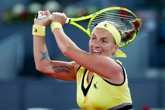 Russia's Svetlana Kuznetsova in action against Canada's Eugenie Bouchard during the Mutua Madrid Open tennis quater-final at La Caja Magica in Madrid on Thursday