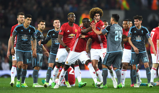 Players from both sides clash before Manchester United's Eric Bailly and Celta Vigo's Facundo Roncaglia are given marching orders by the referee