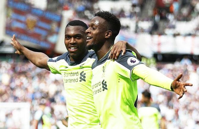 Liverpool's Divock Origi celebrates scoring their fourth goal with teammate Daniel Sturridge during their match against West Ham at London Stadium on Sunday