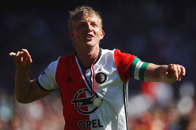Feyenoord Rotterdam captain Dirk Kuyt celebrates in front of the home fans after winning the Dutch Eredivisie at De Kuip or Stadion Feijenoord in Rotterdam, Netherlands, on Monday