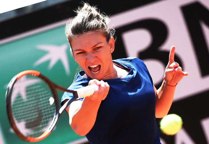 Romania's Simona Halep returns the ball during her match against Estonia's Anett Kontaveit