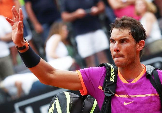 Rafael Nadal waves to the crowd as he leaves the court after his loss against Dominic Thiem in the Italian Open quarter-final on Friday