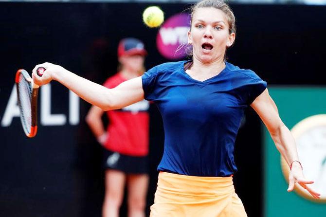 Halep returns the ball during the Italian Open semi-final against Kiki Bertens in Rome on Saturday