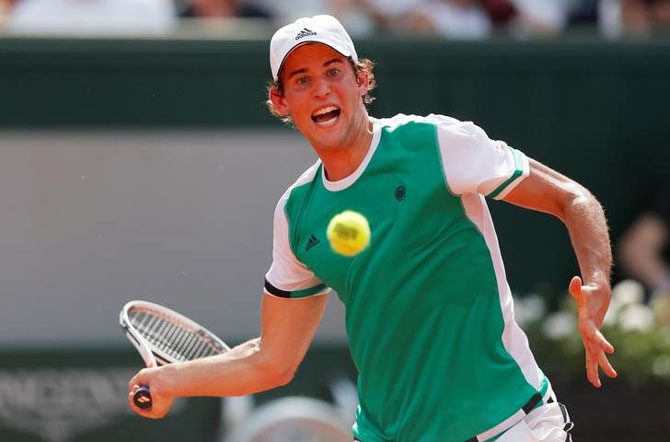 Austria's Dominic Thiem in action during his first round match against Australia's Bernard Tomic