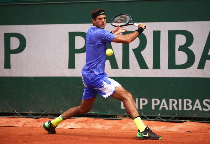Argentina's Juan Martin Del Potro plays a backhand shot during his first round match against compatriot Guido Pella