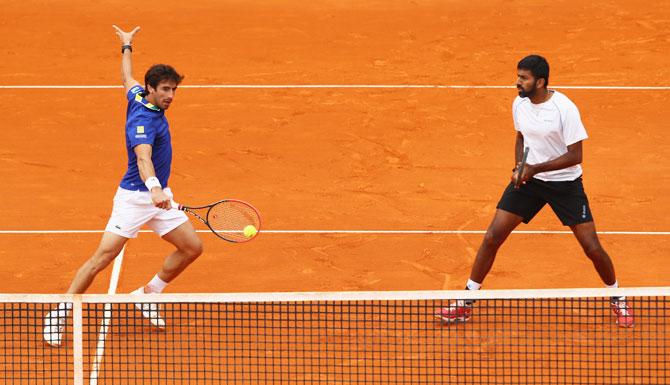 Rohan Bopanna of India and Pablo Cuevas of Uruguay in action