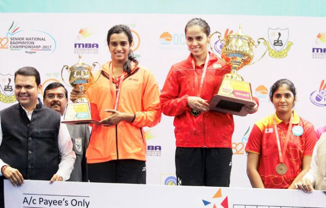 Indian badminton players Saina Nehwal (right) and PV Sindhu on the podium after the Women's singles final at the 82nd Senior National Badminton Championship 2017 in Nagpur on Wednesday