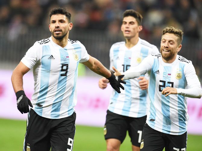 Argentina's Sergio Aguero celebrates with teammate Alejandro Gomez after scoring a goal during an international friendly against Russia at Luzhniki Stadium in Moscow on Saturday