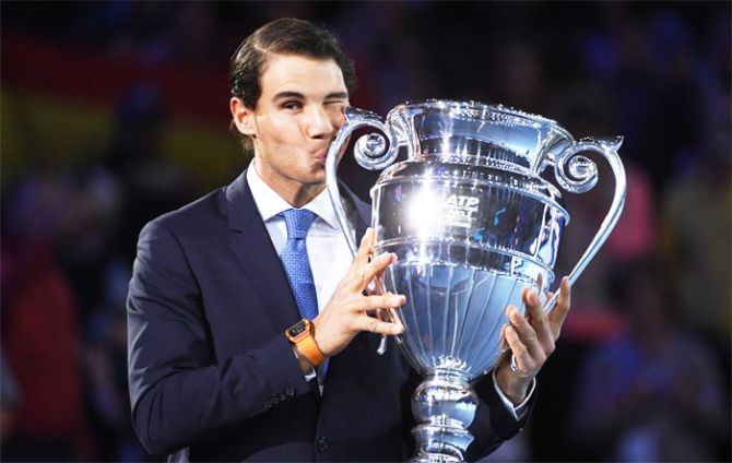 Spain's Rafael Nadal kisses the Emirates ATP year end World Number One trophy after a presentation on the first day of the Nitto ATP World Tour Finals at O2 Arena on Sunday