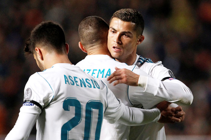 Real Madrid’s Karim Benzema celebrates scoring their fourth goal with teammates Cristiano Ronaldo and Marco Asensio during their Champions League match against APOEL Nicosia at GSP Stadium in Nicosia, Cyprus on Tuesday