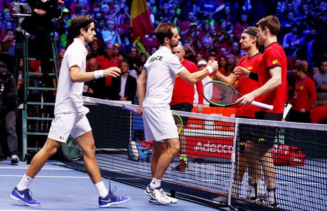 France's Richard Gasquet and Pierre-Hugues Herbert are congratulated by Belgium's Ruben Bemelmans and Joris De Loore after their Davis Cup final doubles match at Stade Pierre Mauroy, Lille, France