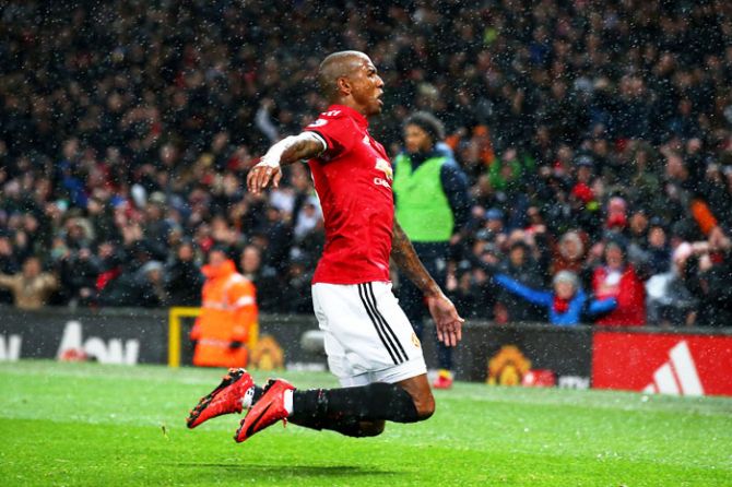 Manchester Unite's Ashley Young celebrates scoring his side's first goal against Brighton and Hove Albion during their English Premier League match at Old Trafford in Manchester on Saturday