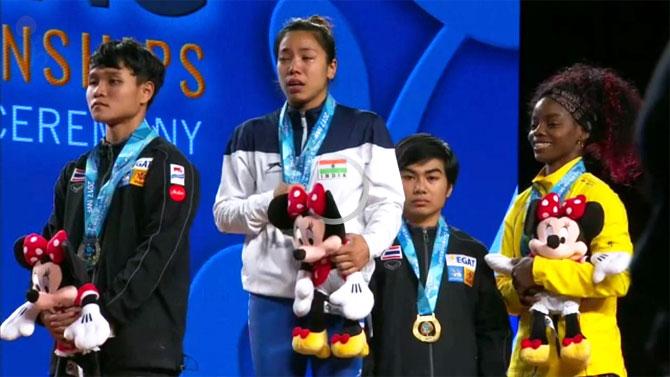 India's Mirabai Chanu is overwhelmed with emotion after winning gold at the World Wrestling Championships in Anaheim, USA, on Wednesday