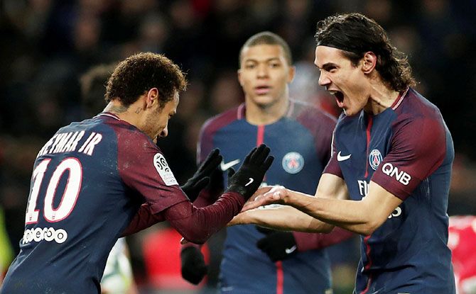 Paris Saint-Germain’s Edinson Cavani celebrates with Neymar after scoring their second goal against Troyes at Parc des Princes stadium in Paris on Wednesday