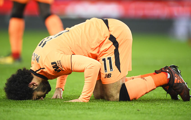 Mohamed Salah of Liverpool celebrates after scoring his side's second goal during their match against Stoke City at Bet365 Stadium in Stoke on Trent