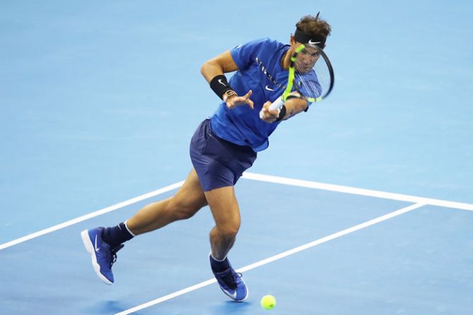 Spain's Rafael Nadal returns a shot during his first round match against France's Lucas Pouille on day four of the China Open at the China National Tennis Centre in Beijing on Wednesday