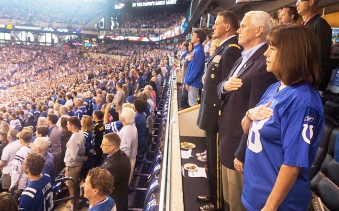 Vice President Mike Pence and Second Lady Karen Pence stand during the national anthem prior to the start of an NFL football game between the Indiana Colts and the San Francisco 49ers at the Lucas Oil Stadium in Indianapolis, Indiana, US on Sunday