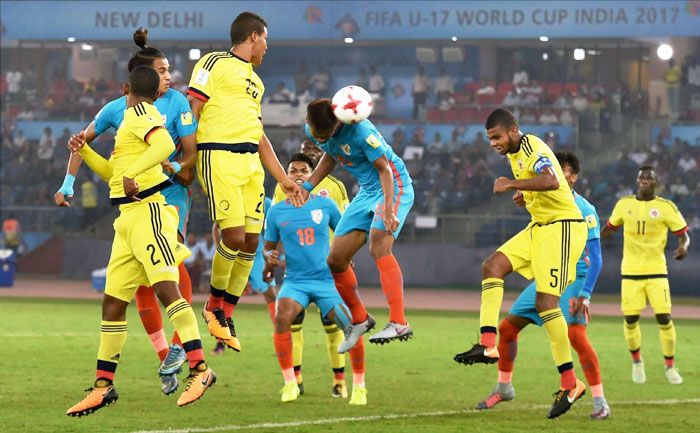 Jeakson Singh Thounaojam (15) heads to score India's first goal against Colombia during the FIFA U-17 World Cup 2017 Group A match in New Delhi on Monday