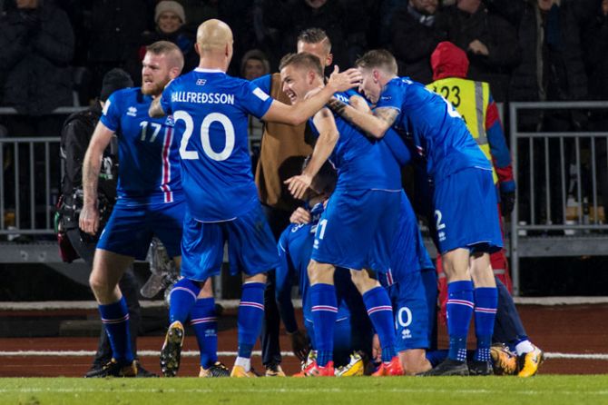 Iceland team celebrate after scoring a second goal against Kosovo