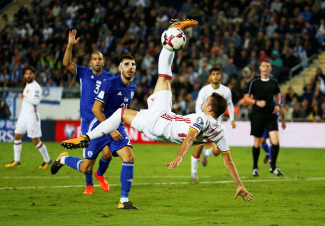 Spain’s Iago Aspas shoots at goal during their match against Israel