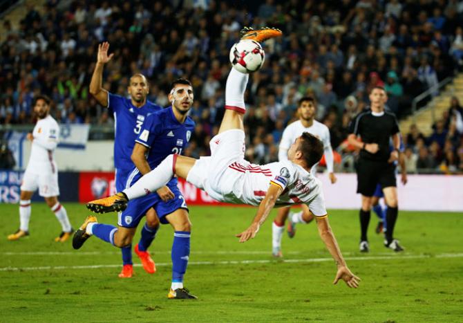 Spain’s Iago Aspas shoots at goal during their match against Israel