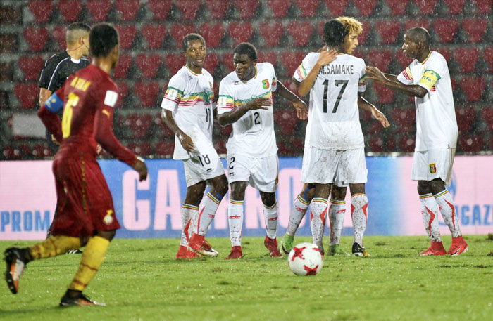 Mali players celebrate after scoring a goal against Ghana during their FIFA U-17 World Cup match at Indira Gandhi Athletic Stadium in Guwahati
