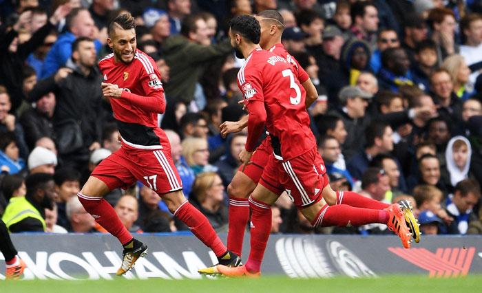 Watford's Roberto Pereyra celebrates scoring his side's second goal with teammates Richarlison de Andrade and Miguel Britos