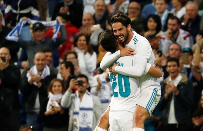 Marco Asensio celebrates scoring Real Madrid's second goal with Isco