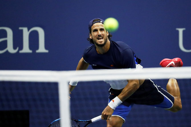 Feliciano Lopez in action during his third round match against Roger Federer