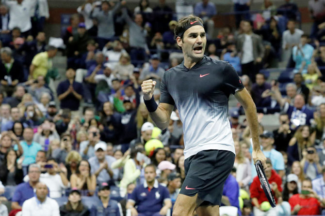 Switzerland's Roger Federer reacts upon winning match point of his third round match against Spain's Feliciano Lopez on day six of the US Open tennis tournament in Ashe Stadium at the USTA Billie Jean King National Tennis Center on Saturday