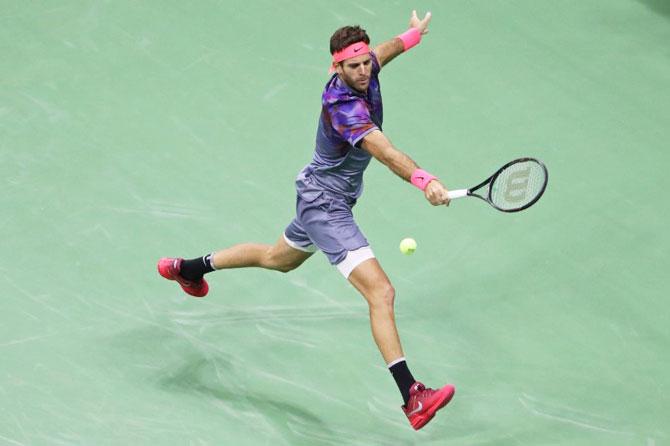 Juan Martin del Potro reaches for a backhand against Rafael Nadal