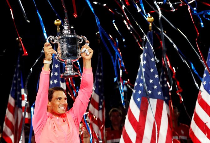 Rafael Nadal holds aloft the trophy after defeating Kevin Anderson to win the US Open on Sunday, his 16th major
