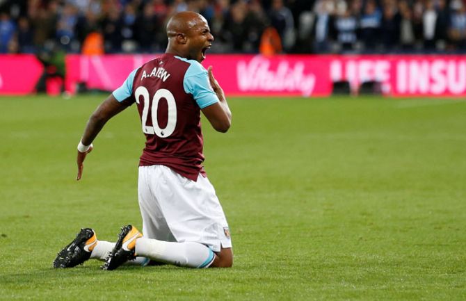 West Ham United's Andre Ayew celebrates scoring their second goal against Huddersfield Town during their English Premier League match in London on Monday