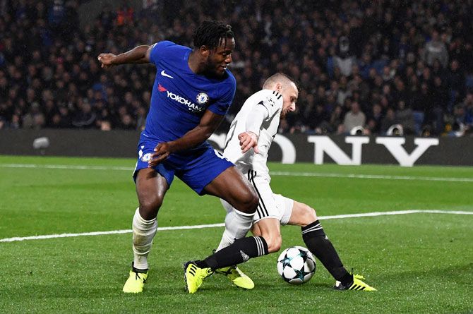 Chelsea's Michy Batshuayi is challenged by Qarabag’s Maksim Medvedev, who end up scoring an own goal to complete the 6-0 rout