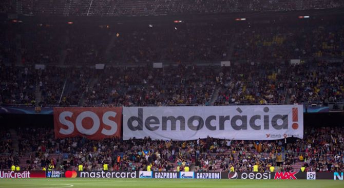 Fans display a banner during the UEFA Champions League Group D match between FC Barcelona and Juventus on Tuesday