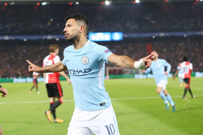 Sergio Aguero celebrates on scoring goal number 50 for Manchester City in the Champions League