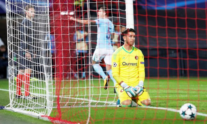 Feyenoord's 'keeper Brad Jones looks dejected after Manchester City's John Stones scores their fourth goal