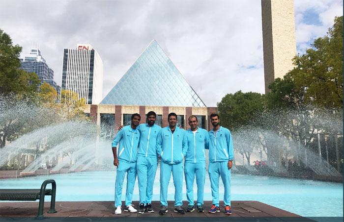 India's Ramkumar Ramanathan, Rohan Bopanna, captain Mahesh Bhupathi (centre) and Yuki Bhambri (left) pose outside the Edmonton City Hall before the draw for their Davis Cup World Group play-off on Thursday