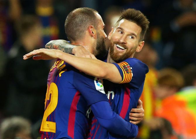 FC Barcelona’s Lionel Messi celebrates scoring their sixth goal with teammate Aleix Vidal during their La Liga match against Eibar at Camp Nou on Tuesday