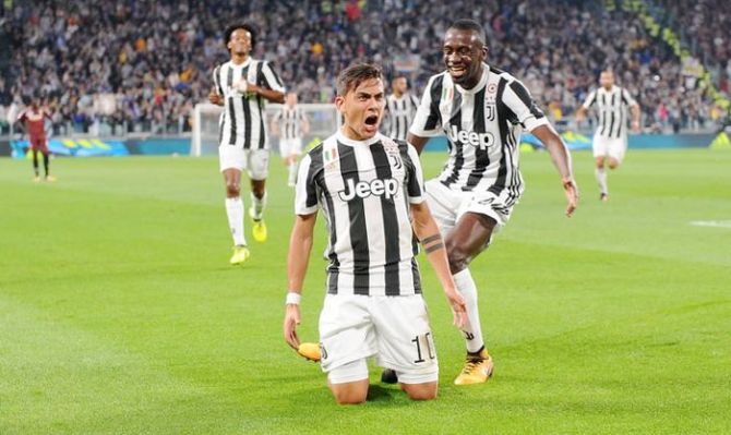 Juventus’ Paulo Dybala celebrates scoring their first goal with Blaise Matuidi during their Serie A match on Saturday