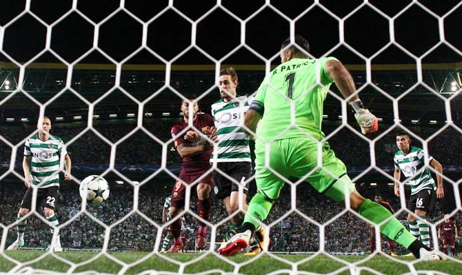  Sporting CP's Sebastian Coates deflects the ball into his own goal against Barcelona
