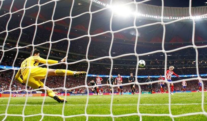 Antoine Griezmann puts Atletico Madrid ahead from the penalty spot against Chelsea