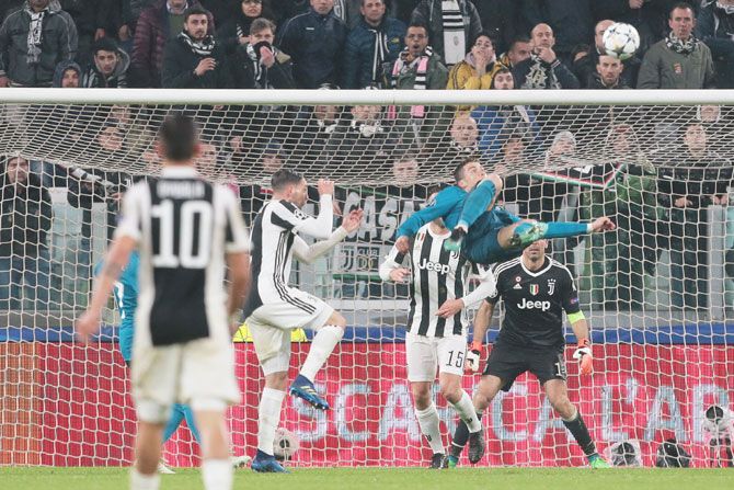 Real Madrid's Cristiano Ronaldo scores an acrobatic second goal against Juventus in during the UEFA Champions League quarter-final first leg match at Allianz Stadium in Turin on Tuesday