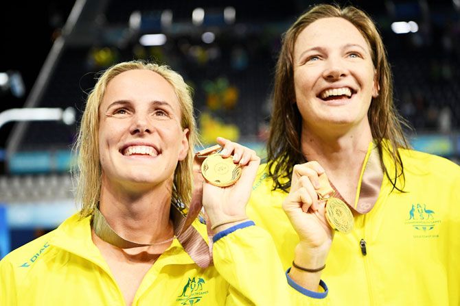 Gold medalists Bronte Campbell and Cate Campbell of Australia pose during the medal ceremony for the Women's 4 x 100m freestyle relay final on Thursday