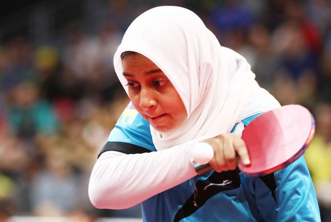 Mauritius’s Raqayyah Kinoo competes in the Table Tennis women team preliminary rounds against Australia at Oxenford Studios