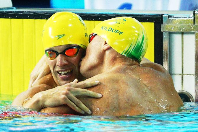 Australia’s Mitchell Kilduff kisses compatriot Daniel Fox (left) following the Men's S14 200m Freestyle Final at Optus Aquatic Centre