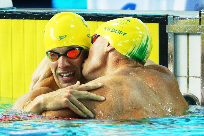 Australia’s Mitchell Kilduff kisses compatriot Daniel Fox (left) following the Men's S14 200m Freestyle Final at Optus Aquatic Centre